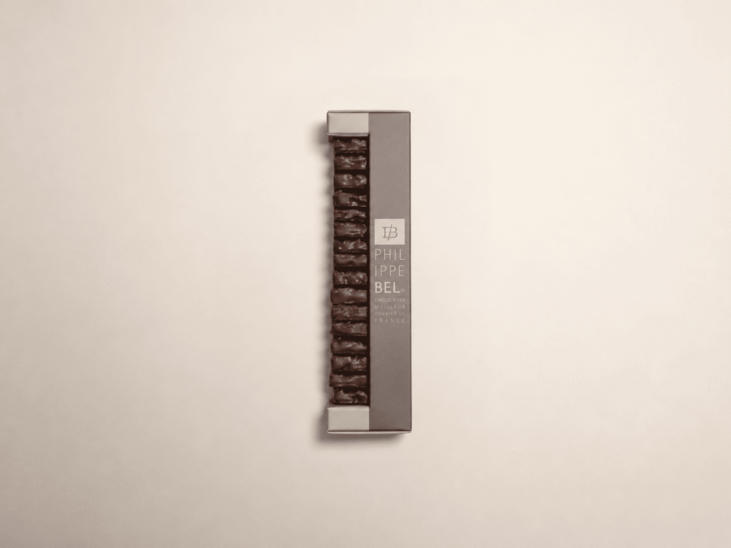 Amande effilée et caramélisée, orange confite et miel enrobé de chocolat noir  - 160g