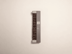 Amande effilée et caramélisée, orange confite et miel enrobé de chocolat noir  - 160g